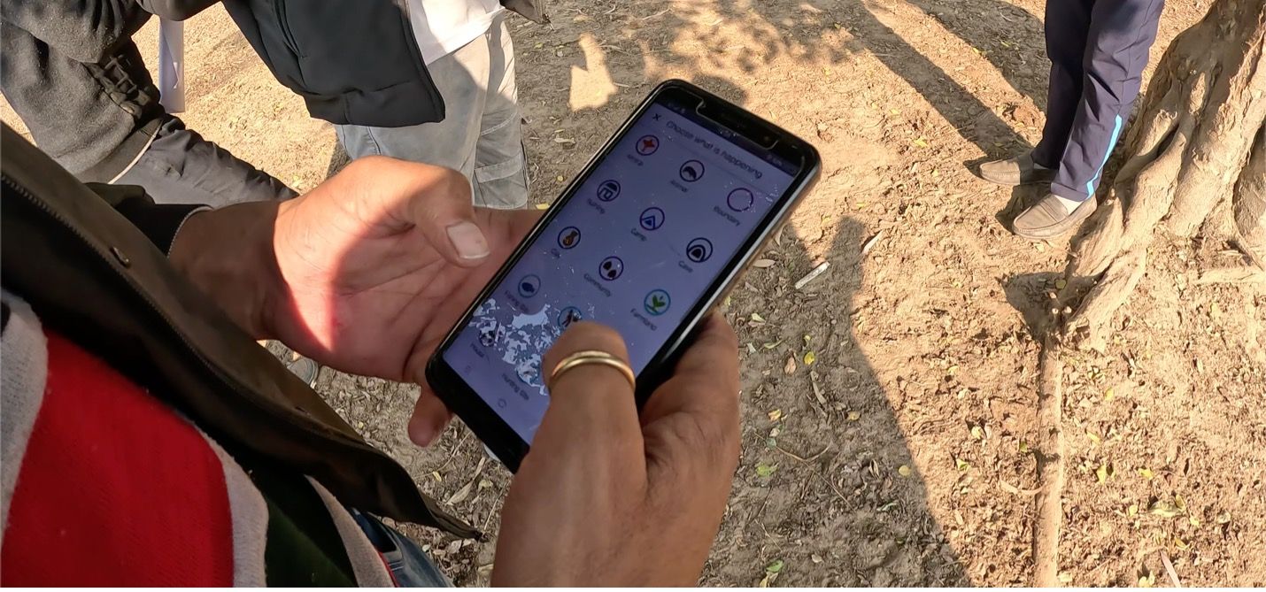 Smart Forests project photo of Van Gujjar community member using mobile application to designate land use. Uttarakhand, India. Trishant Simlai with Smart Forests, 2022.