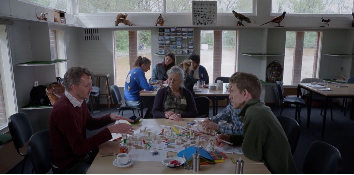 Smart Forests film showing field school participants discussing biodiversity plans and practices at Ecodorp Boekel. The Netherlands. Mind the Film with Smart Forests, 2025.